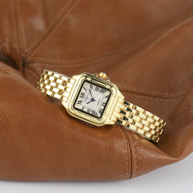 Relógio feminino Grealy com pulseira refinada e mostrador minimalista em tons dourados e brancos