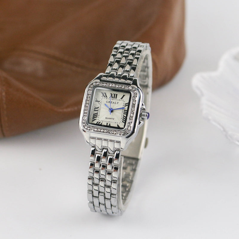 Relógio feminino Grealy com pulseira refinada e mostrador minimalista em tons dourados e brancos