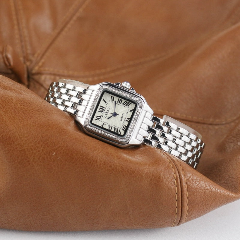 Relógio feminino Grealy com pulseira refinada e mostrador minimalista em tons dourados e brancos