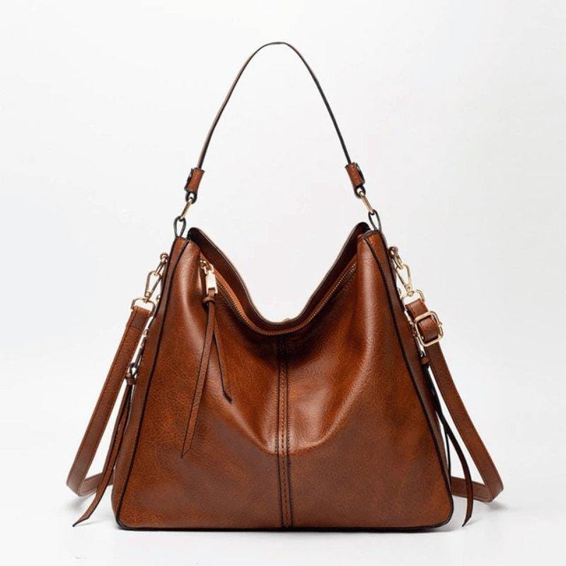 Bolsa feminina modelo hobo em couro sintético, com alça única e formato arredondado. Confortável, elegante e ideal para uso diário.