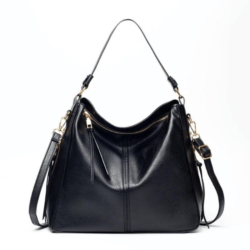 Bolsa feminina modelo hobo em couro sintético, com alça única e formato arredondado. Confortável, elegante e ideal para uso diário.