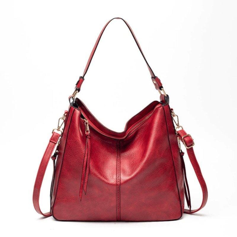 Bolsa feminina modelo hobo em couro sintético, com alça única e formato arredondado. Confortável, elegante e ideal para uso diário.