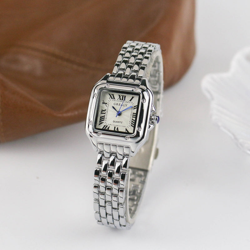 Relógio feminino Grealy com pulseira refinada e mostrador minimalista em tons dourados e brancos